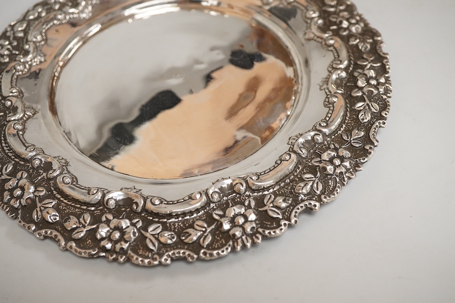 Two Indian white metal rose bowls, one octagonal with stand, diameter 12.5cm, together with a small white metal stand, with foliate border.
